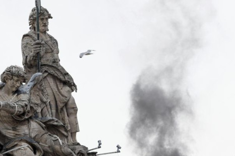 Black smoke billows from the Sistine Chapel, indicating the Catholic Church is still without a sitting pope.