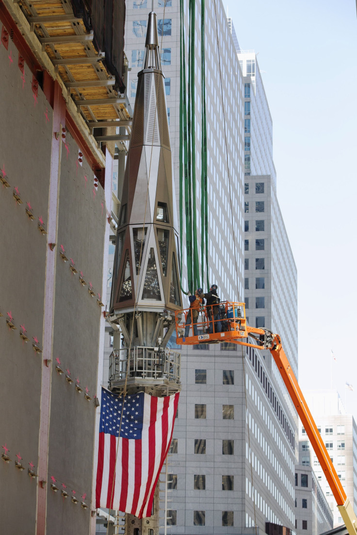 the finale piece of the Freedom Tower before being hoisted on to the new WTC