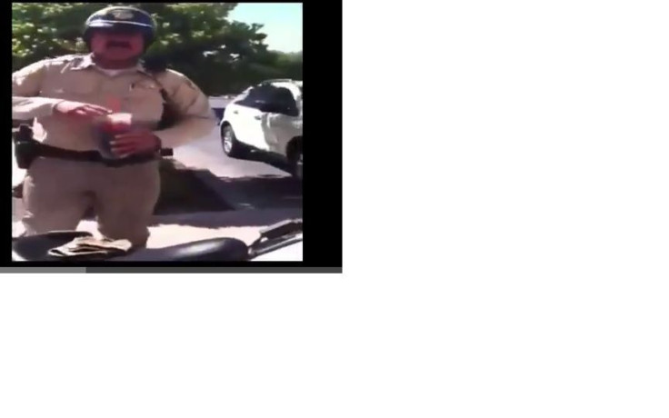 The officer called out by a 12-year-old for illegal parking.