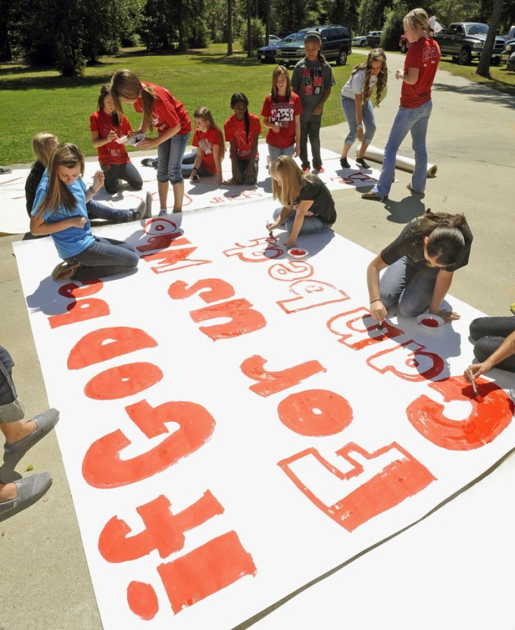 Kountze High School cheerleaders making banners