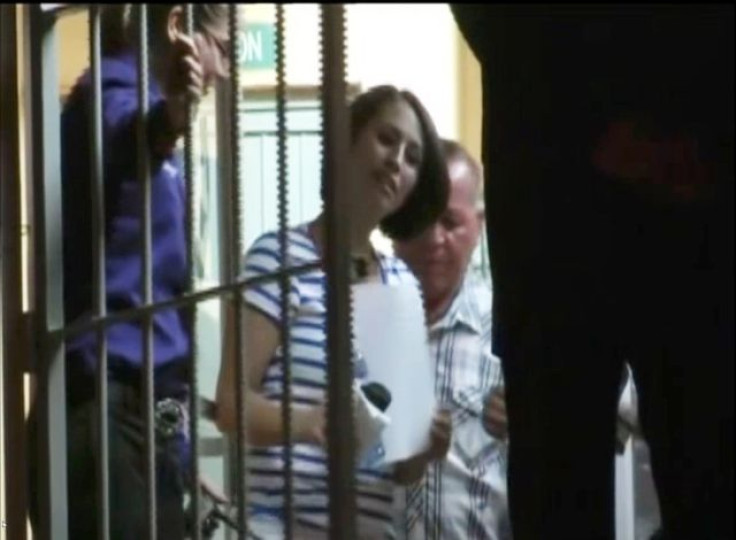 Yanira Maldonado, of Arizona walks out of a prison in Nogales, Mexico May 30, 2013 in this still image from video.