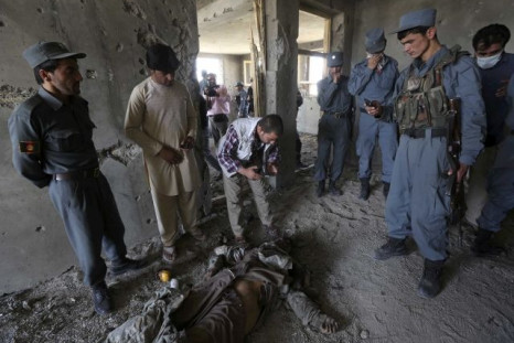 The body of a Taliban fighter lies on the ground in a building that was attacked near the Kabul military airport.