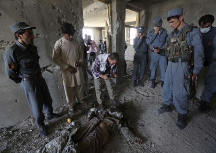 The body of a Taliban fighter lies on the ground in a building that was attacked near the Kabul military airport.