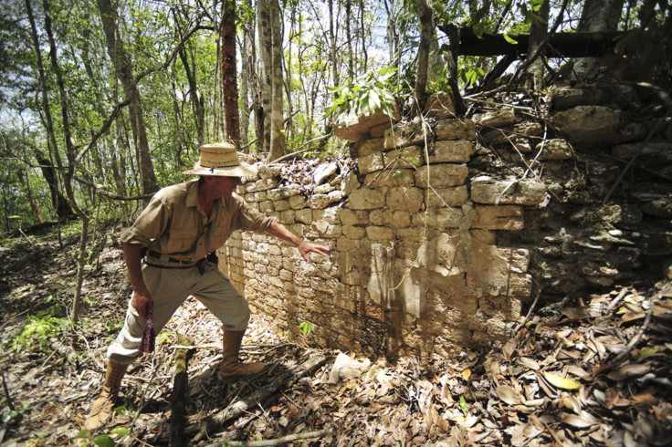 A National Institute of Anthropology and History (INAH) worker shows the remains of a building at the newly discovered ancient Maya city Chactun in Yucatan peninsula.