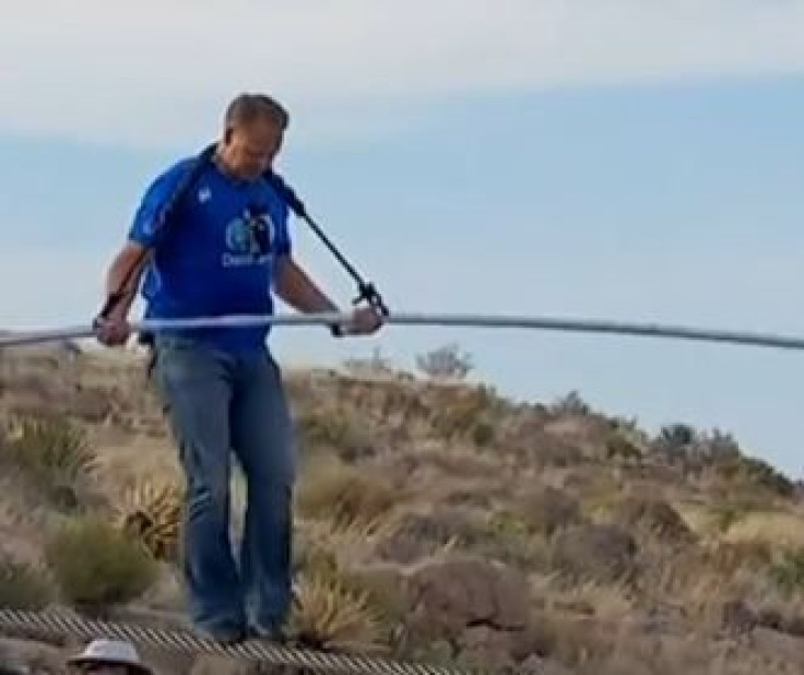 Nik Wallenda walks across the Grand Canyon. 