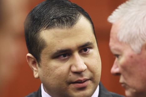 George Zimmerman talks to court security investigator Robert Hemmert after the jury leaves the courtroom for more deliberations in Sanford.
