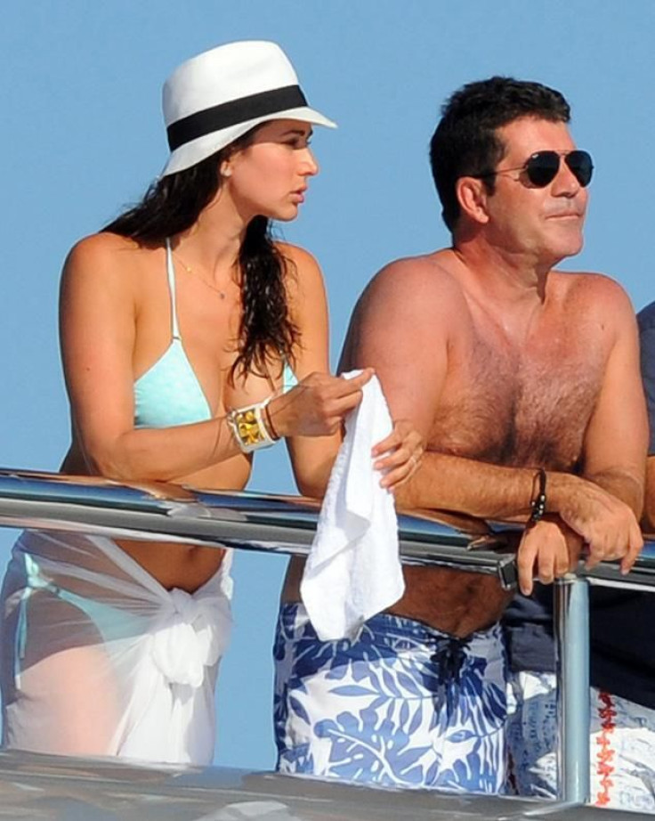 Lauren Silverman and Simon Cowell vacationing last August in St. Bart's with her husband, Andrew, in tow.