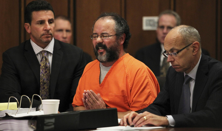 Ariel Castro, 53, breaks down while talking about the child that he fathered with Amada Berry as he addresses the court while seated between attorneys Craig Weintraub and Jaye Schlachet in the courtroom in Cleveland.