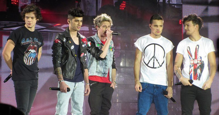 One Direction performing on their Take Me Home Tour, February 2013. From left to right: Harry Styles, Zayn Malik, Niall Horan, Liam Payne and Louis Tomlinson.