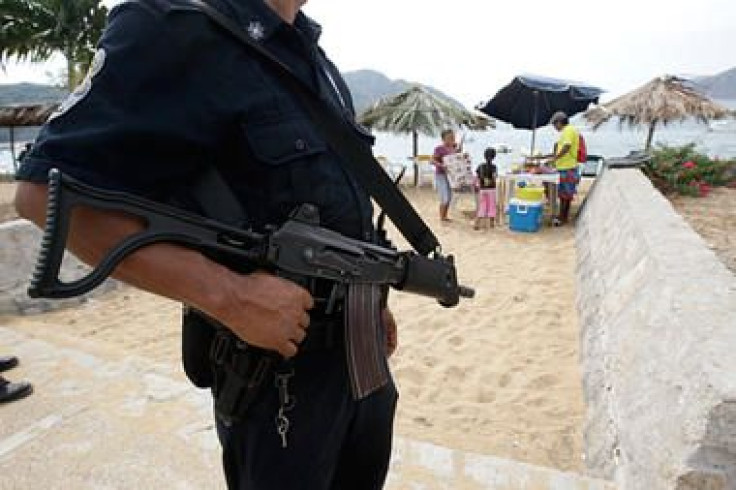 A police officer on the beach in Acapulco, Mexico.