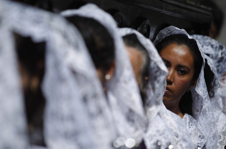Women carry an image of the Virgen De la Asuncion in Guatemala City.