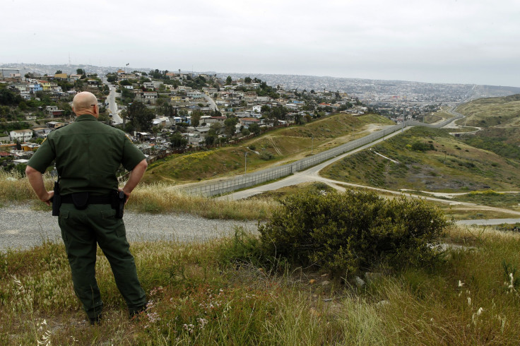 US Border Patrol agent Shawn Gisler looks across the fence at Mexico near the border in San Ysidro, California, in 2011.