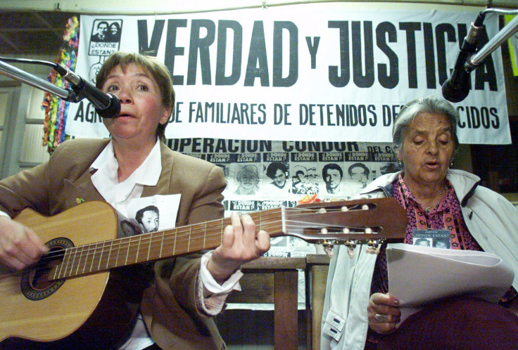 Members of the Chilean group Family Members of the Detained and Disappeared sing as they await a British court's decision on whether to try former Chilean general Augusto Pinochet on torture charges.