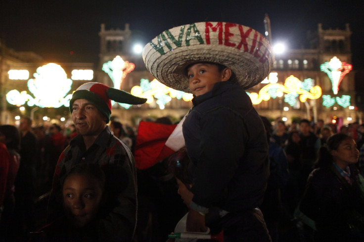A boy and his family take part in Mexican independence day celebrations in Mexico City on September 15.