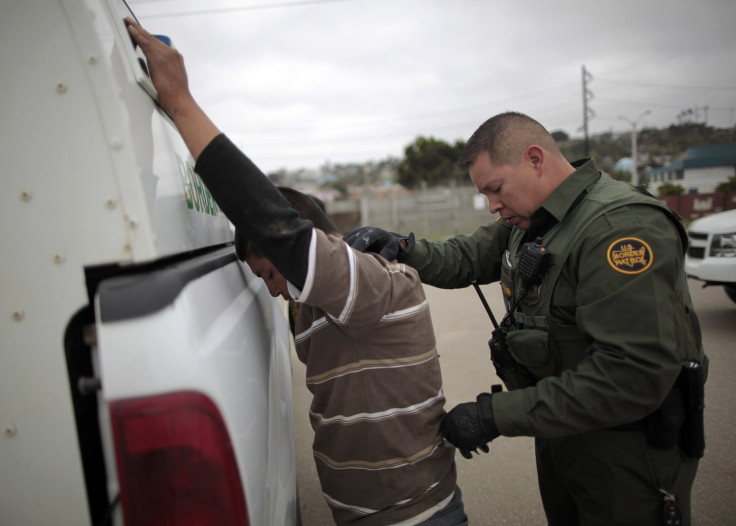 A Border Patrol agent catches an undocumented border crosser near San Ysidro, California.