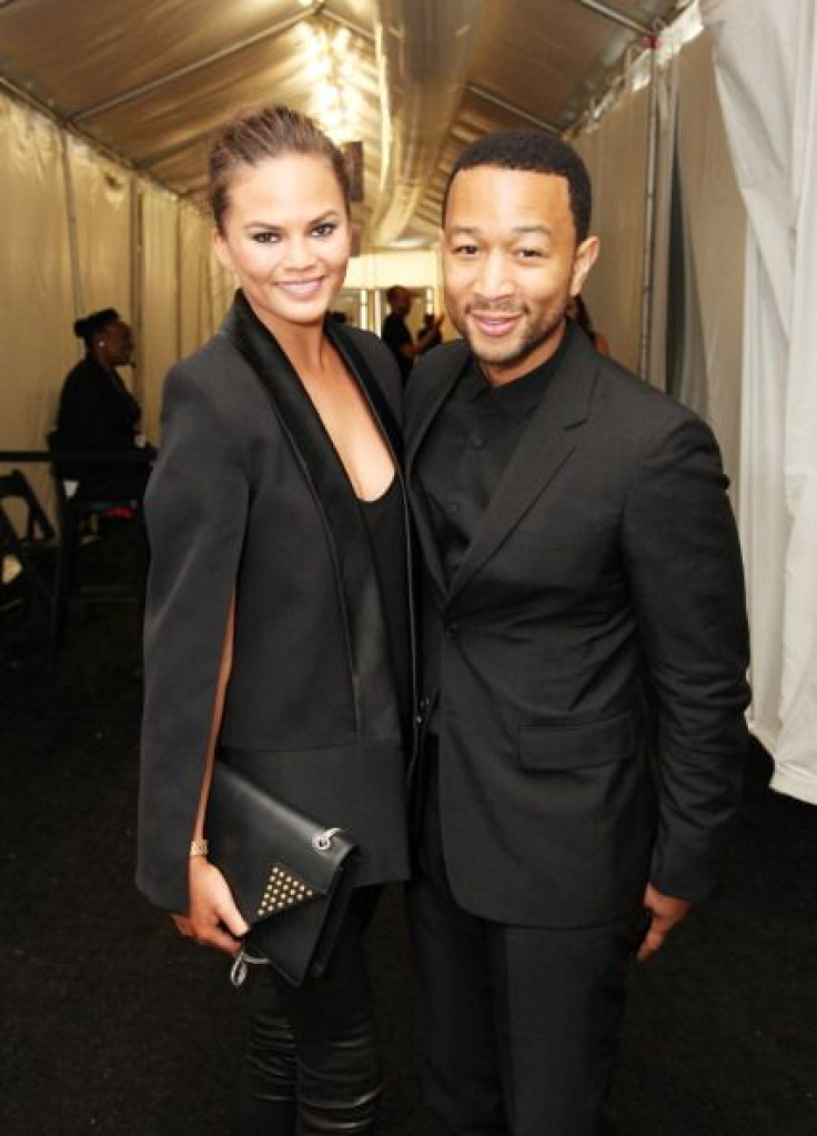 Chrissy Teigen poses with her husband, John Legend, the couple was recently married in an intimate ceremony in Lake Como, Italy. 