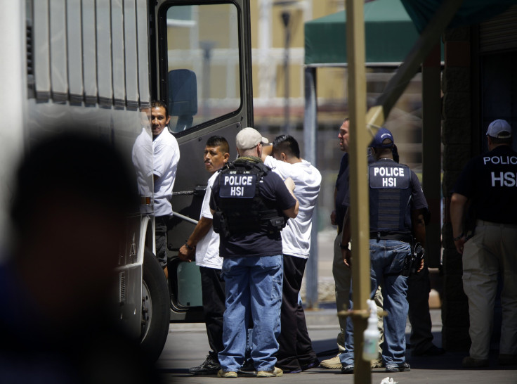 ICE agents detain workers after raiding a Phoenix car wash in August.