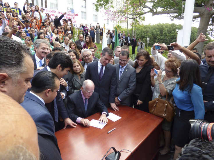 California Gov. Jerry Brown at the signing ceremony of an earlier bill giving undocumented immigrants the right to get driver's licenses last week.