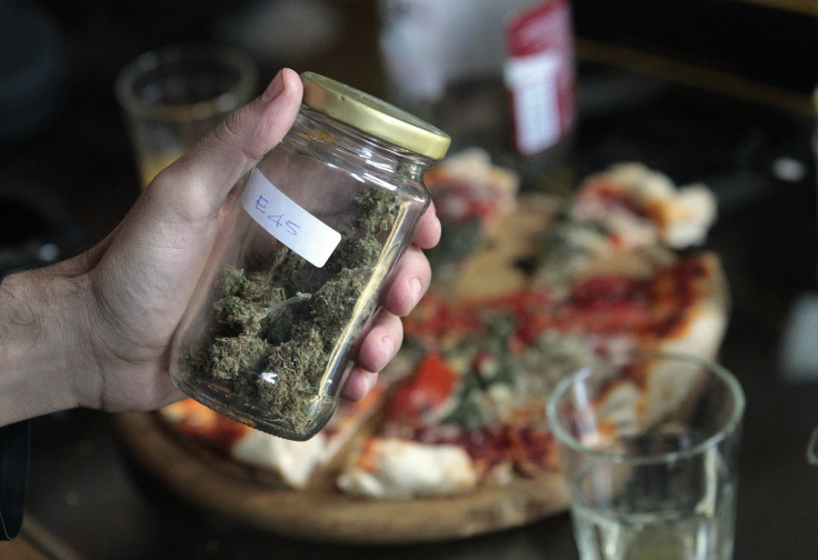 A judge holds a jar of marijuana during a judging session of Uruguay's second "Cannabis Cup" in Montevideo in June.