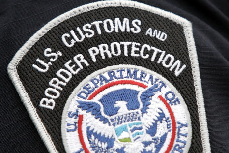 A US Customs and Border Protection badge.