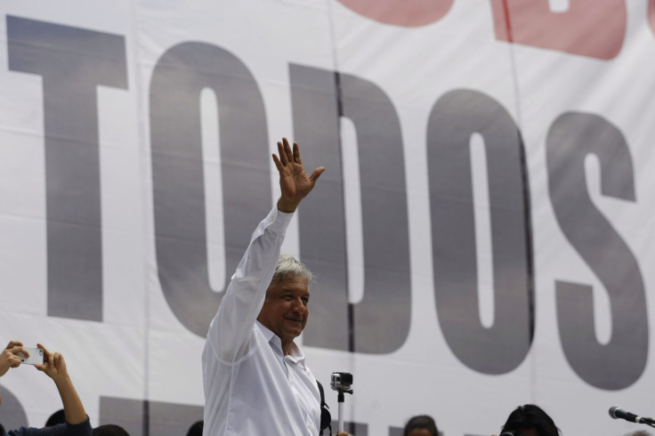 Mexican leftist Andres Manuel Lopez Obrador waves during a political gathering to protest against energy reforms at Reforma avenue in Mexico City September 22, 2013.