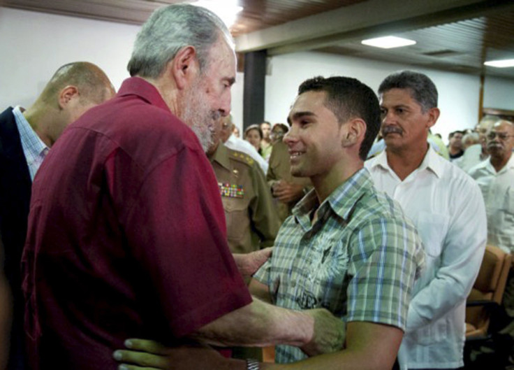 Former Cuban leader Fidel Castro (L) talks to Cuban shipwreck survivor Elian Gonzalez (R) during the launch of Castro's autobiography "The Strategic Victory" in Havana August 2, 2010.