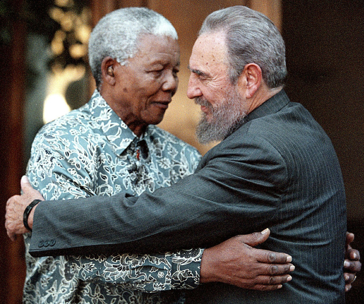 Former South African President Nelson Mandela (L) hugs Cuba's President Fidel Castro during a visit to Mandela's home in Houghton, Johannesburg in this September 2, 2001 file photo.