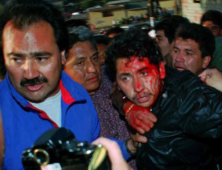 Mario Aburto Martinez (R) is grabbed by security personnel after shooting PRI presidential candidate Luis Donaldo Colosio after a campaign rally in Tijuana, March 23, 1994.