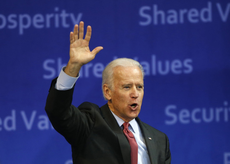 Vice President Joe Biden waves to the crowd as he leaves after delivering his speech at Yonsei University in Seoul December 6, 2013.