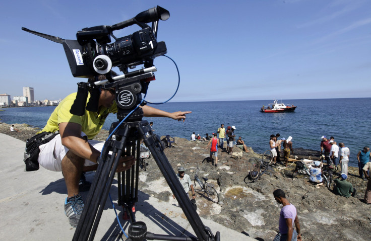 Actors prepare for the filming of a scene from Cuban director Marilyn Soraya's movie "Vestido de Novia" (Wedding Dress), by the sea off Havana's seafront boulevard 'El Malecon' May 21, 2013.