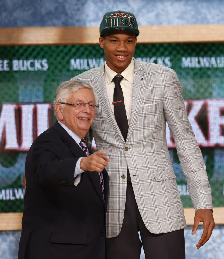 Giannis Antetokounmpo (R) from Greece stands with NBA Commissioner David Stern after being selected by the Milwaukee Bucks as the 15th overall pick in the 2013 NBA Draft in Brooklyn, New York, June 27