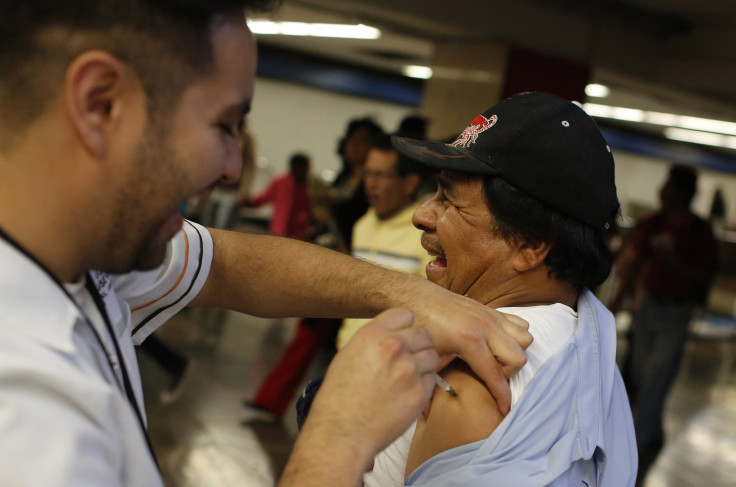 A man gets the flu vaccine in Mexico City.