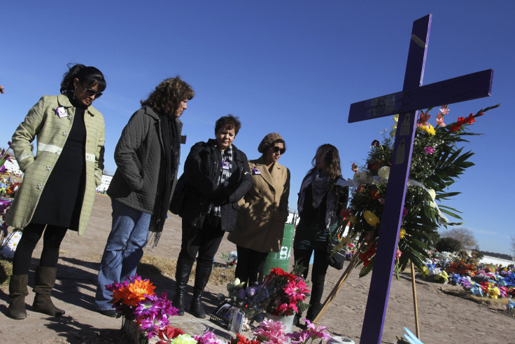 Anti-drug violence demonstrators at a fellow activist's grave.