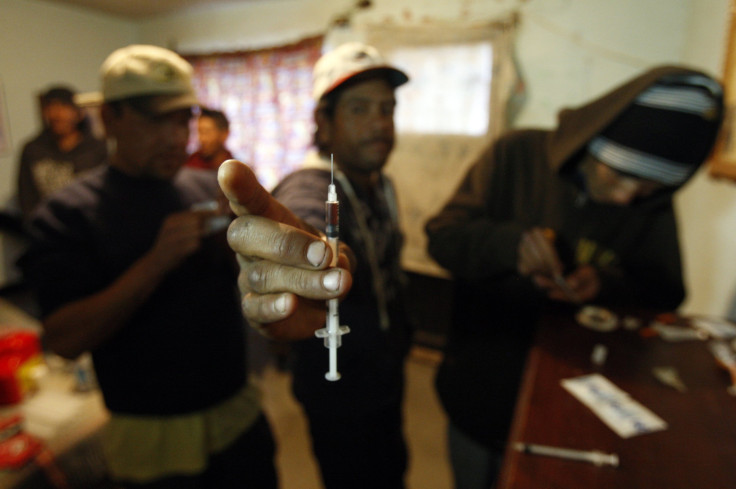 A drug user shows a syringe in Juarez.