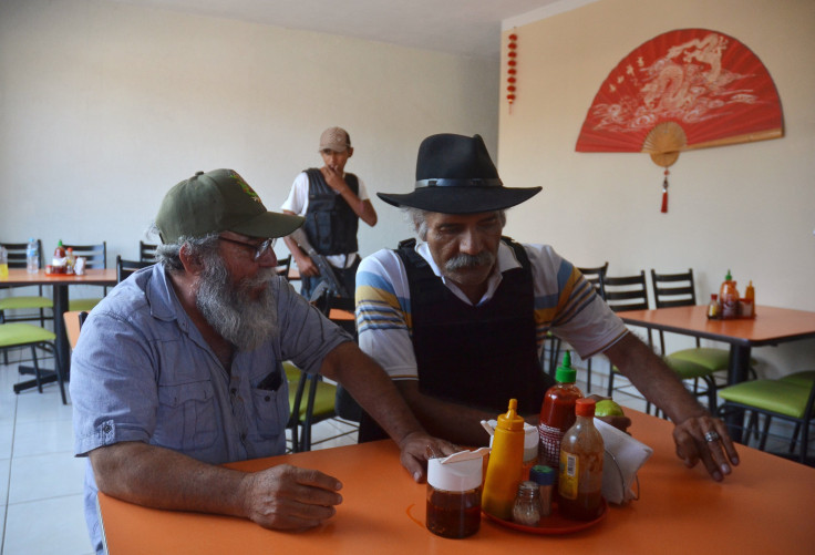 Mireles (right) and new leader Estanislao Beltran (left)