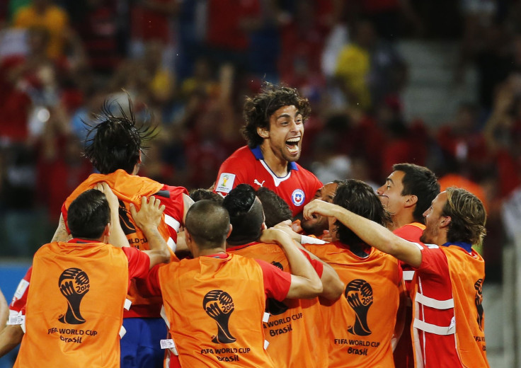 Chile's Jorge Valdivia (top) celebrates his goal