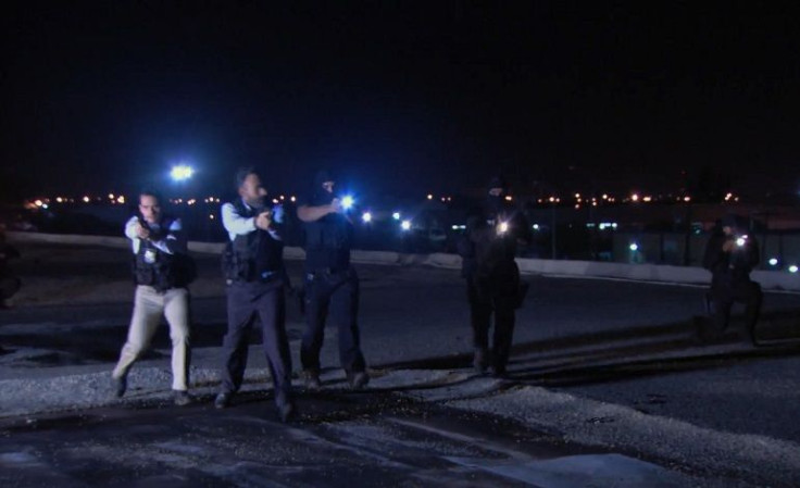 Police with Captain Nestor Fernandez