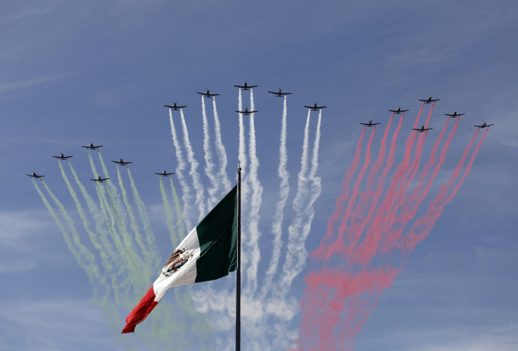 Planes fly in formation over the Mexican national flag