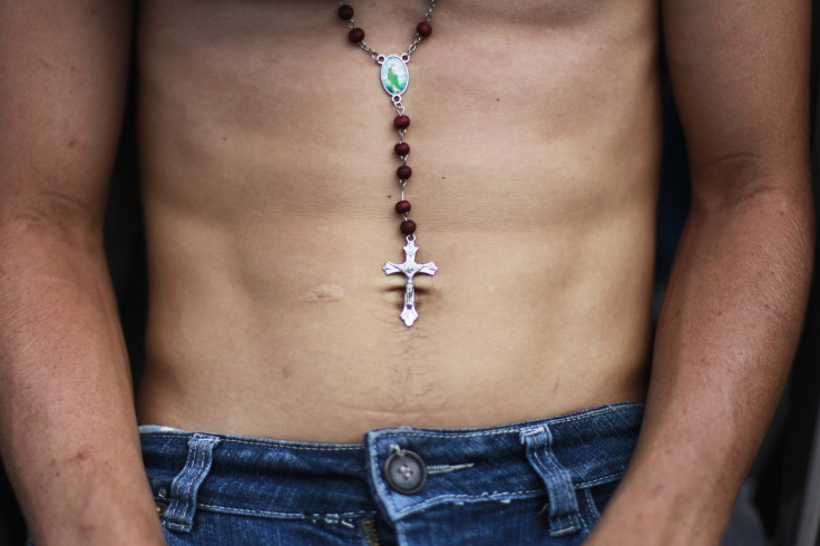 latino man abs, rosary