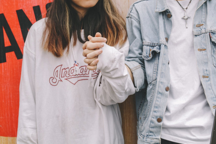 Couple holding hands