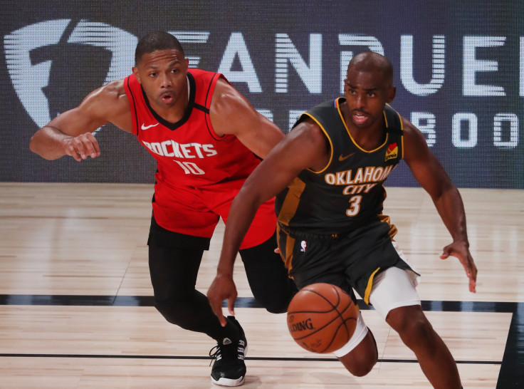 Eric Gordon #10 of the Houston Rockets defends as Chris Paul #3 of the Oklahoma City Thunder