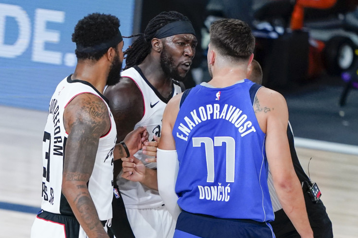 Montrezl Harrell of the LA Clippers and Luka Doncic #77 of the Dallas Mavericks