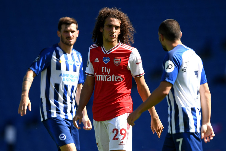 Matteo Guendouzi of Arsenal confronts Neal Maupay of Brighton and Hove Albion