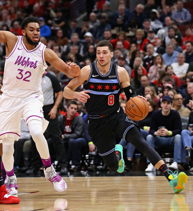  Zach LaVine #8 of the Chicago Bulls drives past Karl-Anthony Towns #32 of the Minnesota Timberwolves