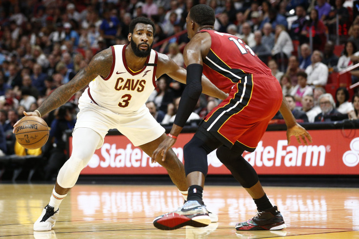 Andre Drummond #3 of the Cleveland Cavaliers dribbles against Bam Adebayo #13 of the Miami Heat