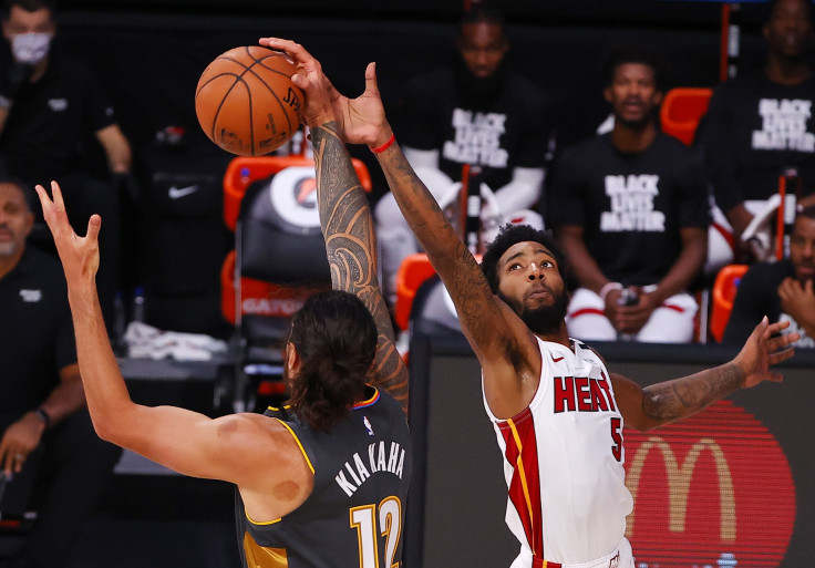 Steven Adams #12 of the Oklahoma City Thunder catches a pass against Derrick Jones Jr. #5 of the Miami Heat