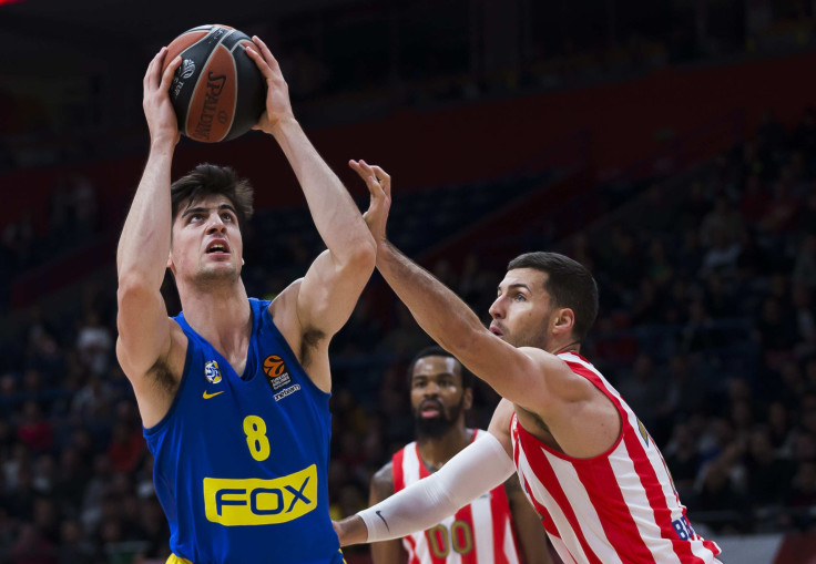 Billy Baron of Crvena Zvezda mts Belgrade tries to block Dei Avdija of Maccabi Fox Tel Aviv 