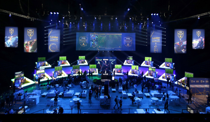 Players compete on Microsoft Xbox and Sony Playstation games consoles in the group stages of the FIFA eWorld Cup Grand Final