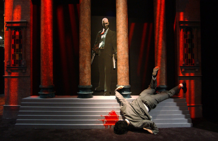 A life-size grisly murder scene draws attention to the exhibit of the violent video game, "Hitman 2 Silent Assassin"