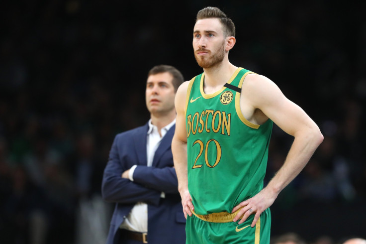 Gordon Hayward #20 of the Boston Celtics stands with Head Coach Brad Stevens